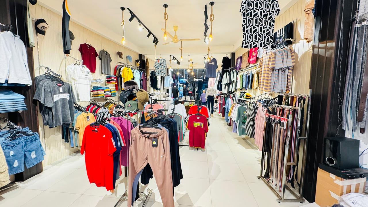 Full store view with racks and lighting